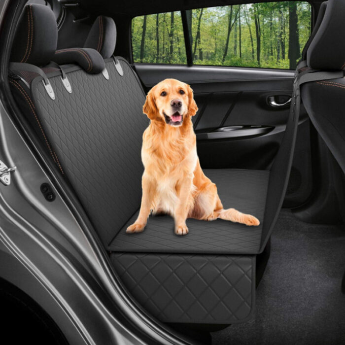 1207385240407.jpg Golden retriever sitting on a protective quilted car seat cover in the back seat of a vehicle, looking at the camera with a happy expression.