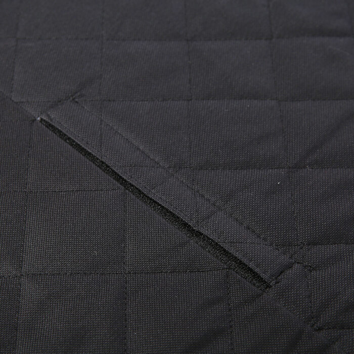 1274687331166.jpg Close-up of dark quilted fabric showing a diagonal slit pocket with a satin-like edge.