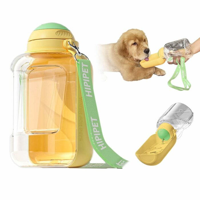 4a62a46d-0525-4029-bd0d-7533b26c4529.jpg Transparent yellow pet water bottle with a green strap; a golden retriever puppy reaches toward the yellow drinking bite valve.