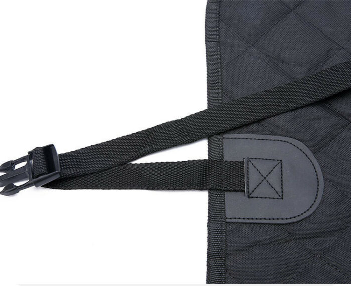 857688812403.jpg Close-up of a black adjustable strap with a plastic buckle attached to a quilted black bag.