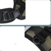 Close-up of black plastic buckles and camouflage strap on a tactical belt or harness.
