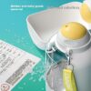 cfb99eff-ab32-400a-824b-79076f49de0c_trans.jpeg Breast pump with clear bottle on a teal surface; overlay text says 'Safe and odorless' and 'Mother and baby grade material'.